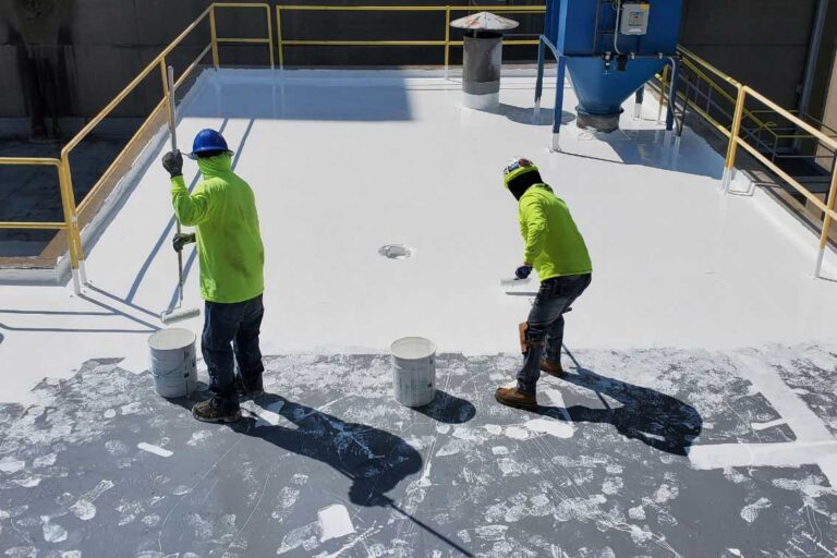 Crew applying Tremco roof coating